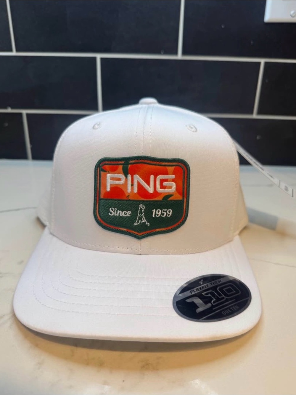 Ping White Hat with Orange and Green Patch